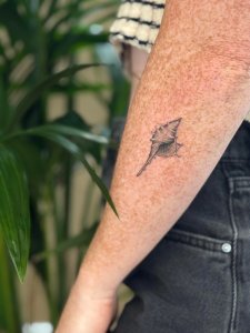 Instagram post by @larinhacaitlin about Celebrity Ink Surfers Paradise